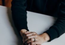 MZ세대를 위한 정신건강 케어, 어떻게 할까? person in black long sleeve shirt holding babys feet